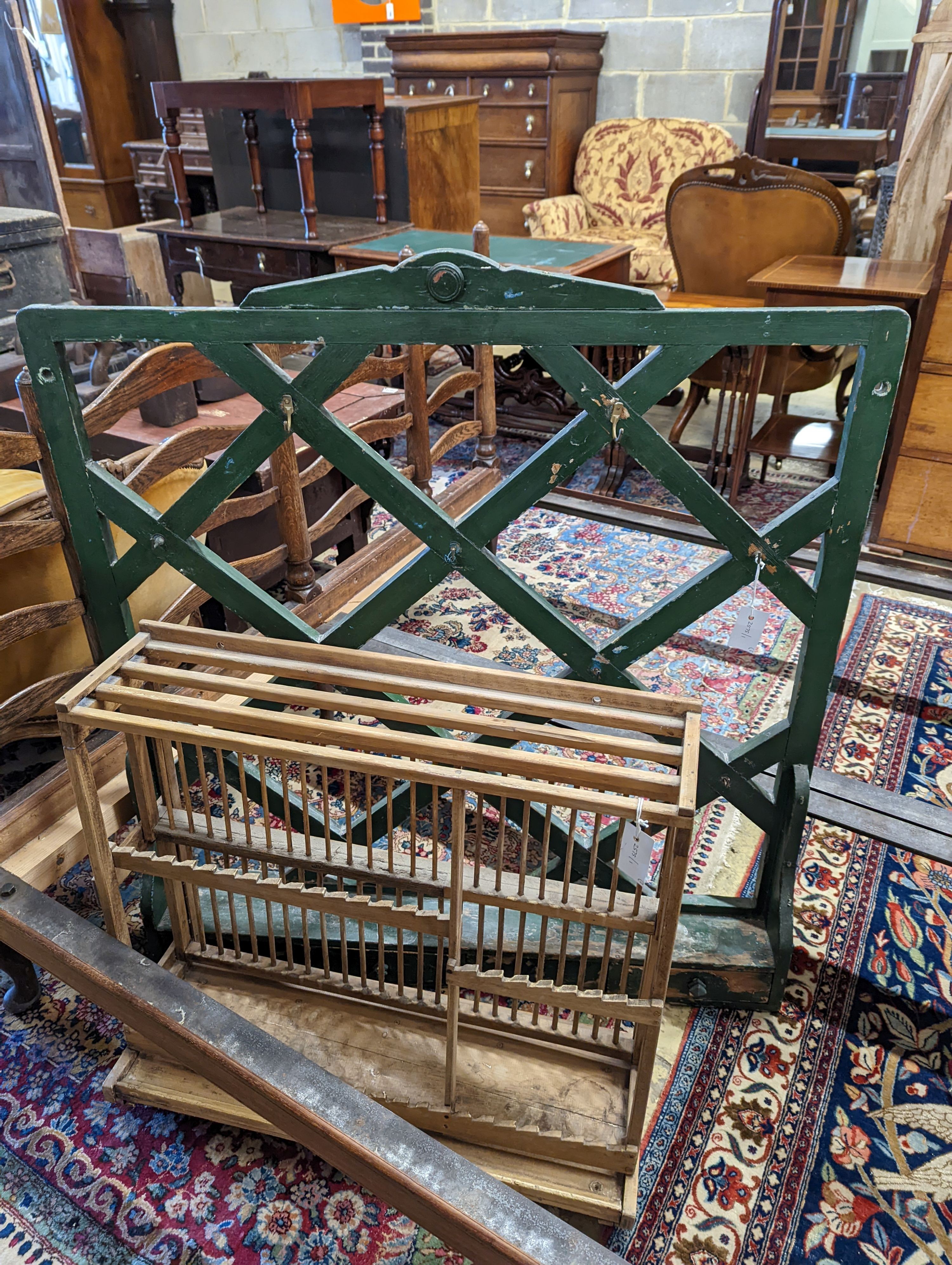 Two 19th century painted wall racks, together with a plate rack, largest width 100cm, height 104cm